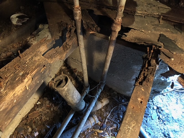 Rotten and decayed area under sink